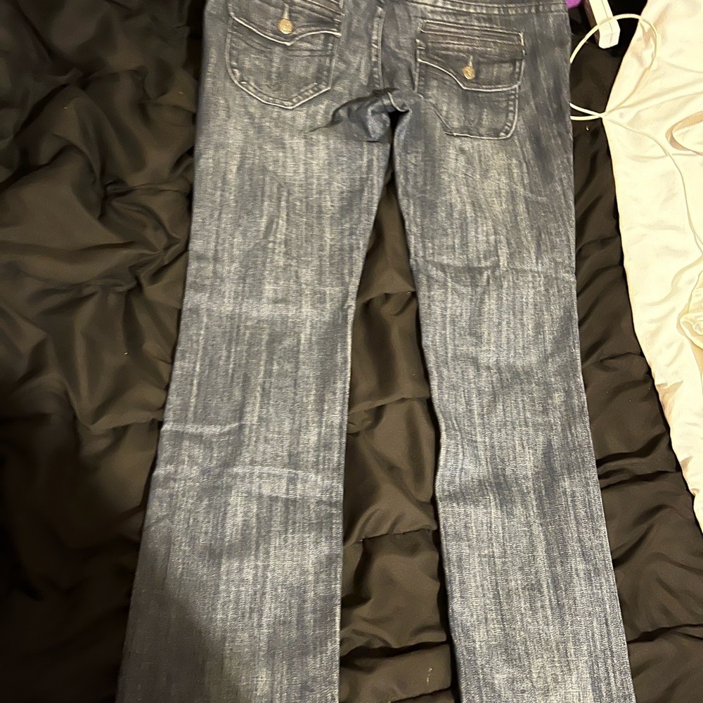 Vigoss I know says skinny but more straight leg, and flap butt pocket